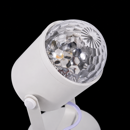 Close-up detail of the premium crystal lens on the ambient water ripple projector with elegant white finish and modern minimalist design.